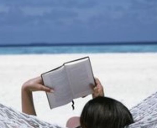 picture of girl reading at the beach