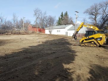 Dirt work. Demolition. Grading dirt.