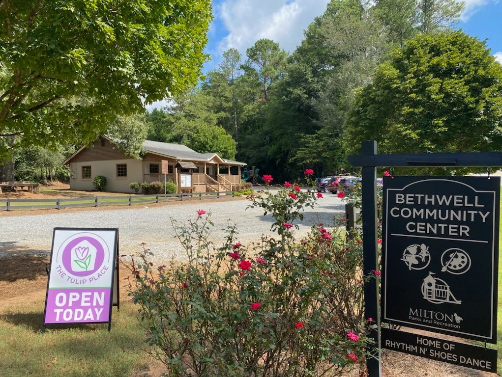 Bethwell Community Center with signs for The Tulip Place and Rhythm N' Shoes Dance.