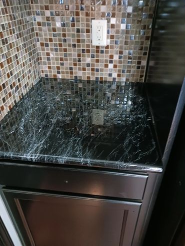 black marble counter top over granite