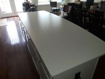 white epoxy counter top over granite