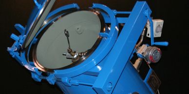 Double Bolt closure with chain and sprocket drive installed on inclined process chemical vessel.