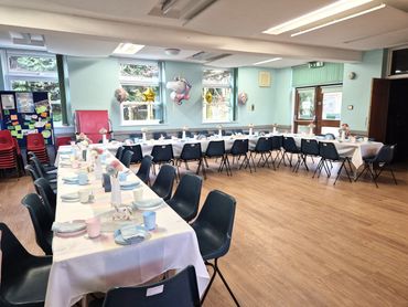 Sustainable Unicorn and rainbow children's party table decoration in Welwyn Garden City hall.