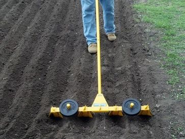 Weights not included. Two 5lbs can be added if desired but are not necessary in well tilled soil. 