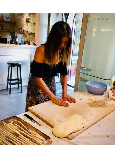 Guest making hand-made fresh pasta, tagliatelle, gnocchi or umbricelli (pici)