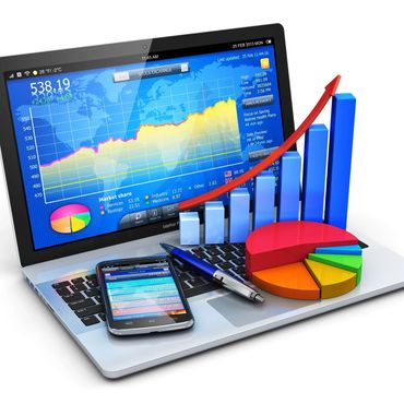 Laptop screen showing stock market data with 3D graphs and a smartphone on the keyboard.
