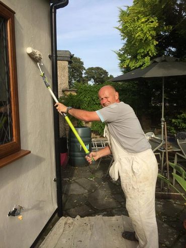 Paul Jull, painter and decorating, painting exterior wall Maidstone, Kent. 