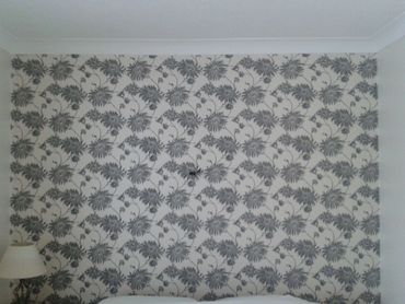 Wallpapered interior wall by Paul Jull decorating. Painter and Decorator, Maidstone Kent. 