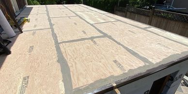 New plywood re-sheathing in Vancouver BC before duradek installation. Deck repair over garage.