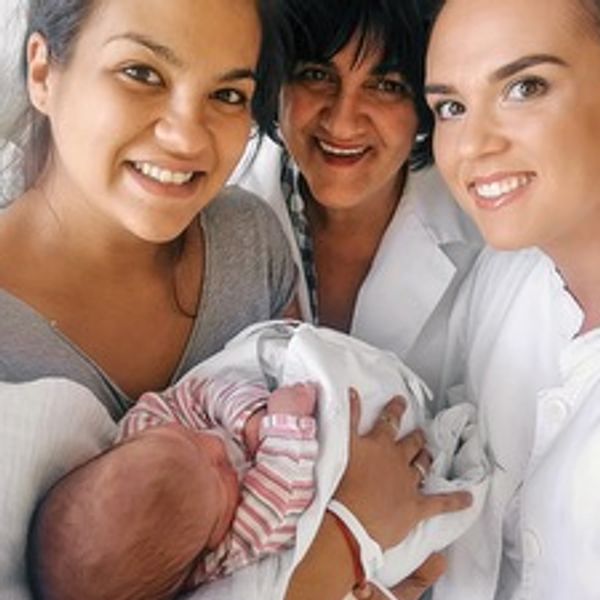Mom after giving birth with her coaches