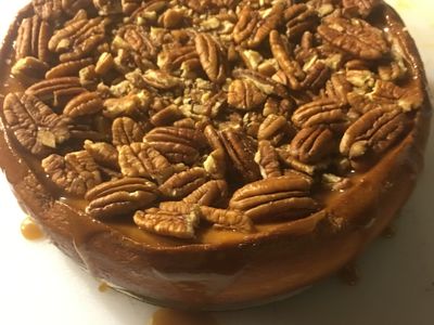 Golden pecan cheesecake with rich buttery caramel and pecans