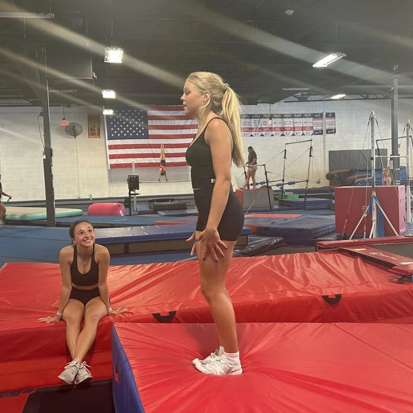 Cheerleader getting ready to tumble.