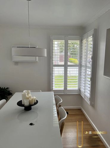 We fitted plantation shutters in this elegant dining area to offer light control and enhance the hom