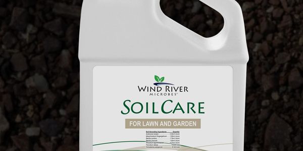 Container of Wind River Microbes SoilCare for lawn and garden.