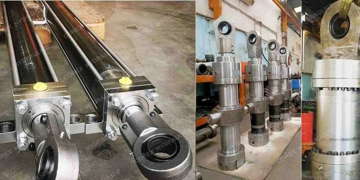 Various hydraulic cylinders and industrial metal components in a workshop.