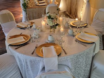 Table decor. centerpieces. linens. glassware. charger plate. runners. table numbers. Chair sashes.