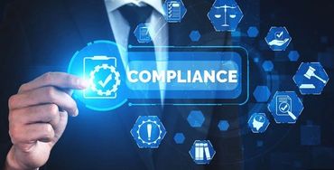 Businessman interacting with digital interface displaying compliance icons.