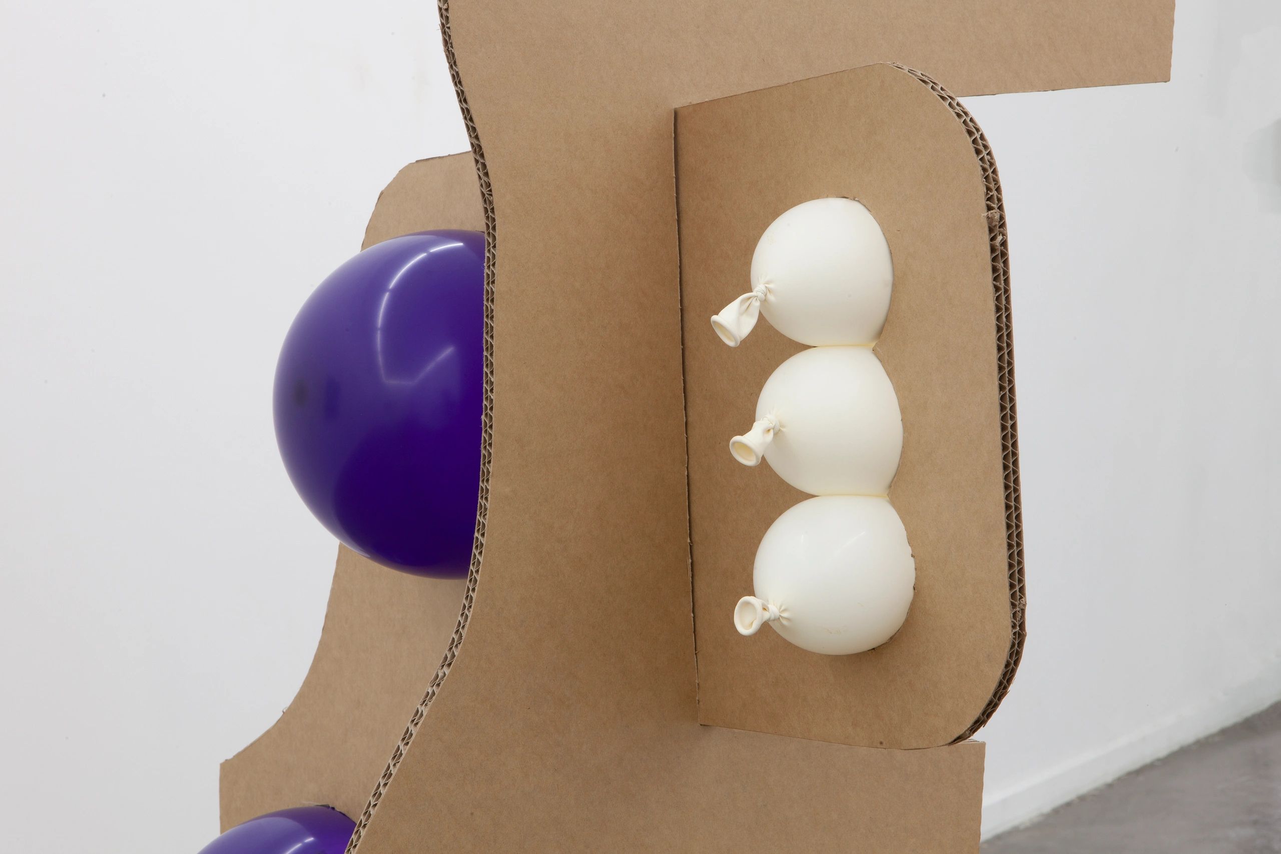The Animal Style (detail), 2003/2023
cardboard and balloons
installed with paintings by Melinda Harp