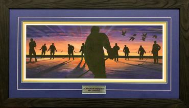 Framed art in memory of the Humbolt Broncos. Silhouettes of hockey players skating on a pond.