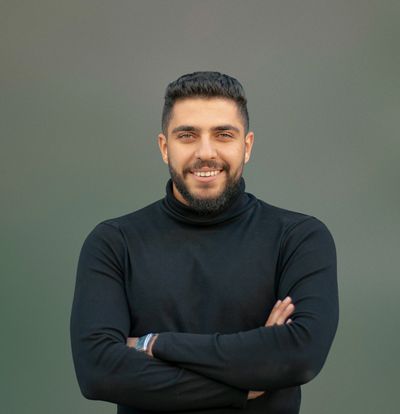 Close up smiling man with arms crossed