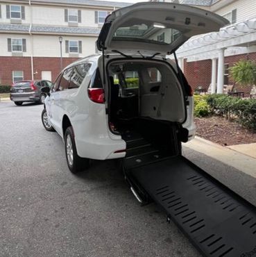 ADA compliant wheelchair van accessible van transport with ramp.