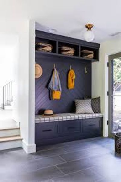Cozy mudroom bench with hooks and storage.
