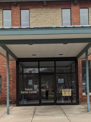 Glass entrance to The Keene Senior Center adjacent to HCS.