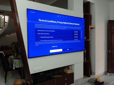 TV screen displaying Samsung Terms & Conditions setup page.