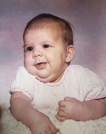 Michelle Haseltine as a baby with a chubby face