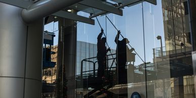 Cleaning windows on lift