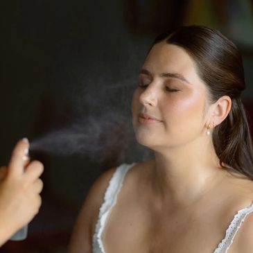 Woman getting a facial spray.