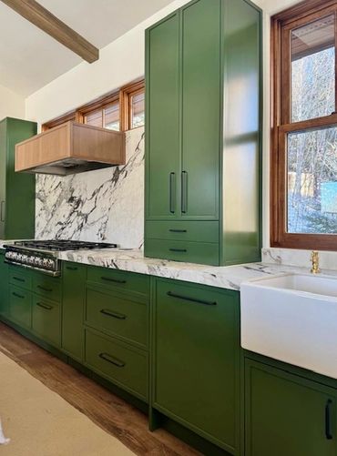 custom green kitchen cabinetry with micro shaker doors
