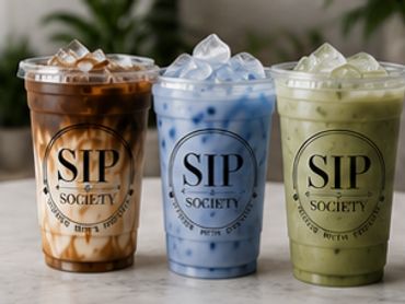 Three colorful iced drinks from SIP Society on a table.