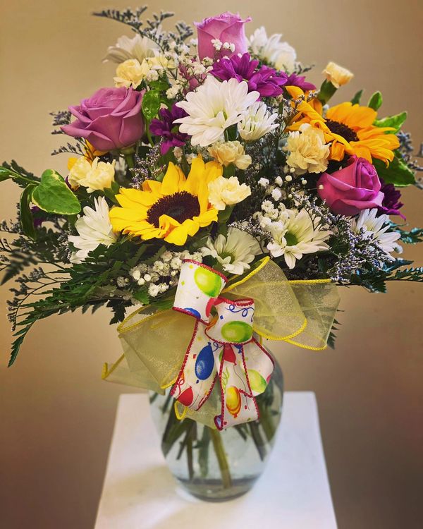 Celebration flowers sunflowers mixed roses daisies