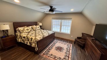 Master Bedroom with king size bed and private bathroom. Also has a 55" television.