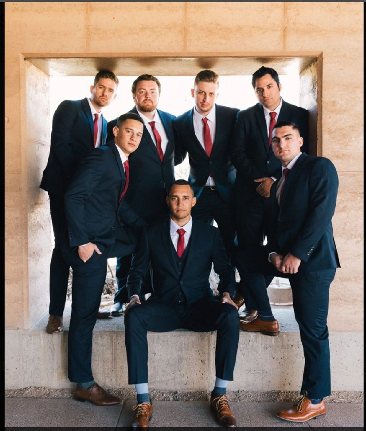 Groomsmen and groom with matching suits