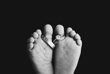 baby toes with wedding rings at newborn session