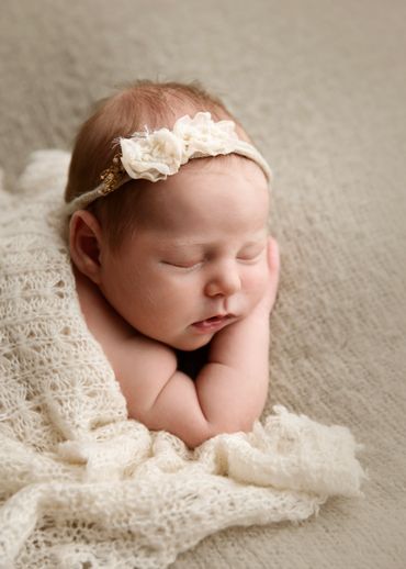 newborn baby with blanket at newborn session