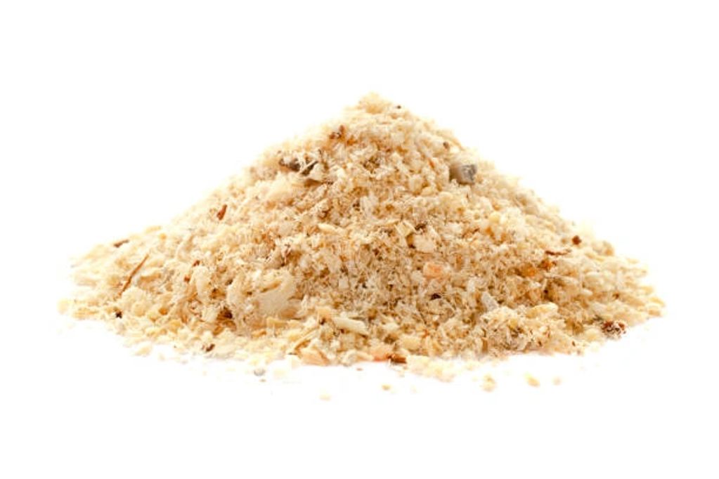 Pile of finely ground sawdust on a white background.