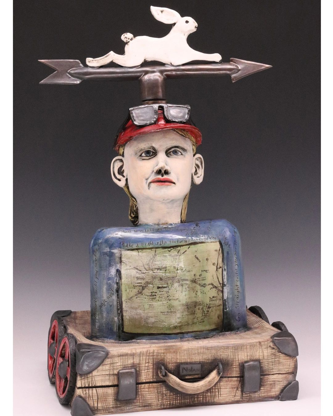 Ceramic sculpture of a Traveler with weathervane