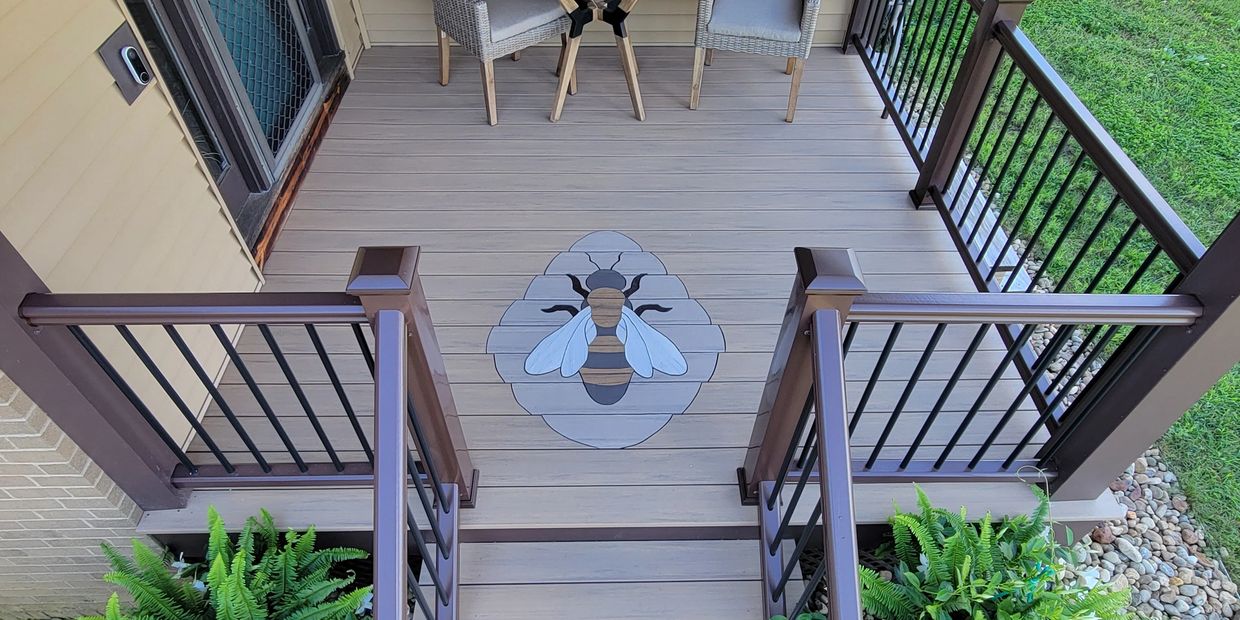 Completed project of the honeybee and hive inlay on a deck