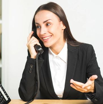 Office manager talking on the phone consulting about a deck design