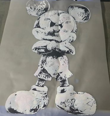 Graffiti-style black and white Mickey Mouse artwork.