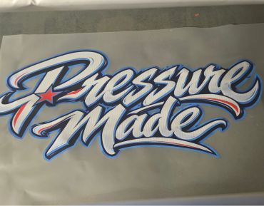 Colorful graffiti-style text saying Pressure Made.