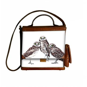 Three burrowing owls drawn with acrylic ink.