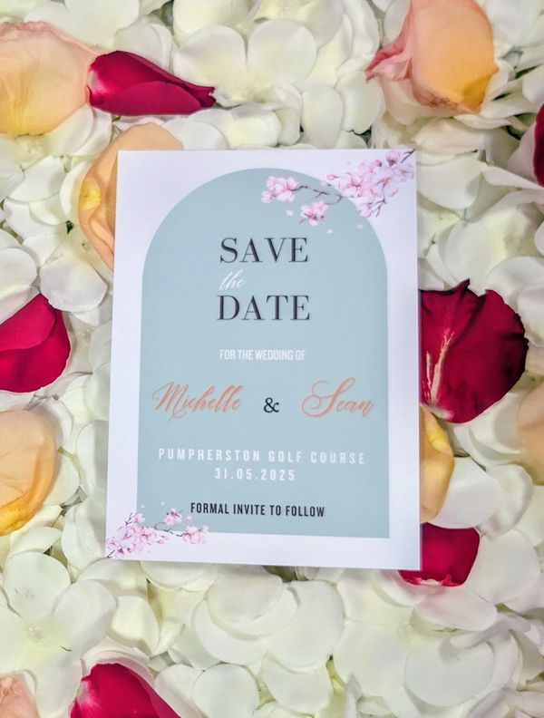 Cherry blossom and sage arch save the date