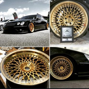 Black Mercedes with custom gold mesh wheels, showcasing luxury and style.