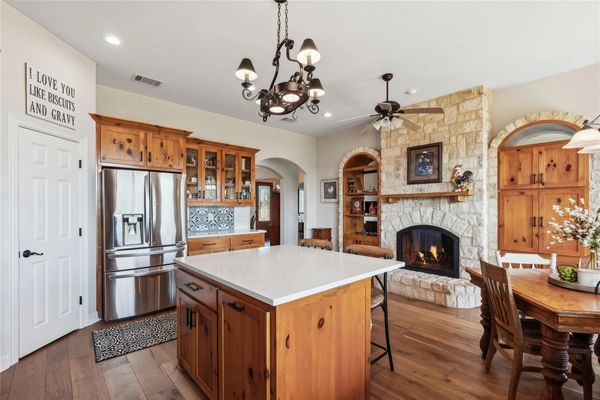 a kitchen with fireplace