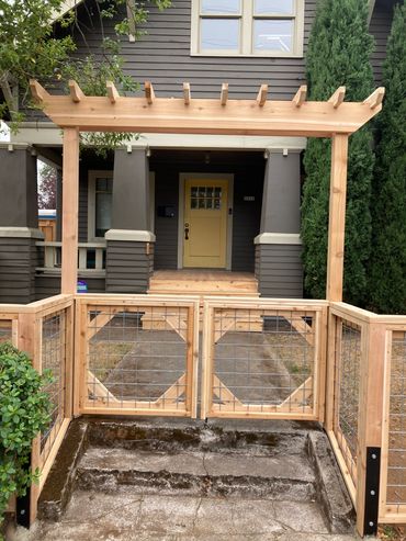 Arbor over utility panel  style double entry gates 