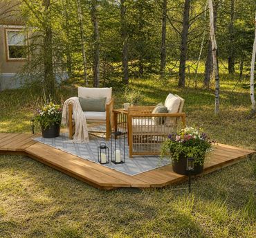 A sun-dappled relaxation nook in the forest by the yurt at Sign of the Pines Retreats.